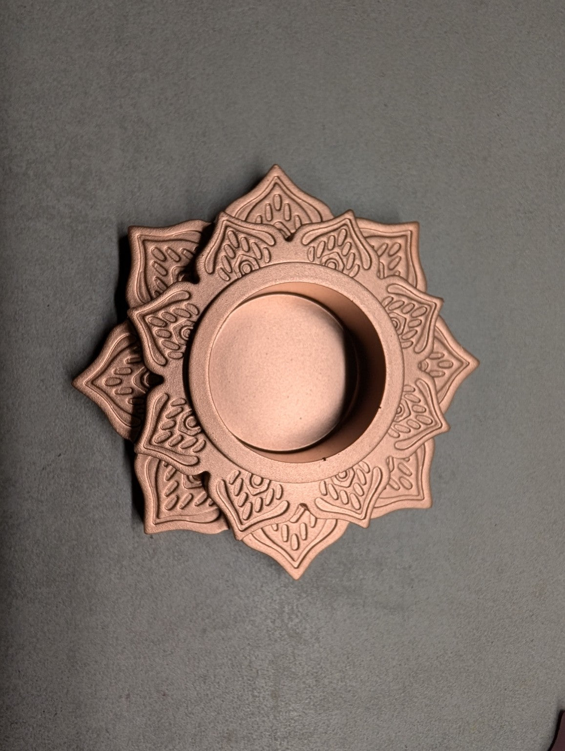 Top view of the Copper Jesmonite mandala tealight holder, showing layered lotus petals and a central recess.