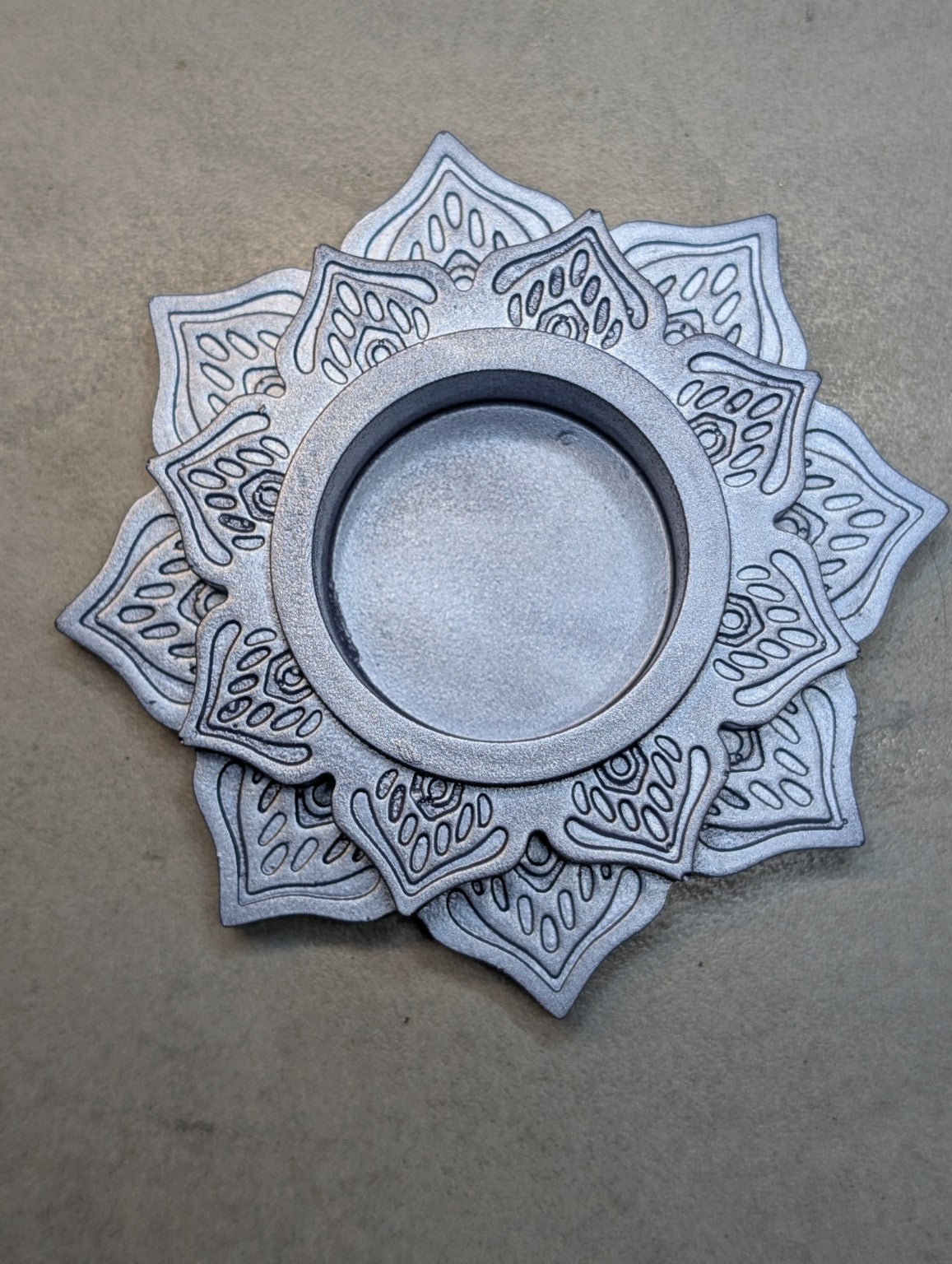 Top view of the Metallic Blue Jesmonite mandala tealight holder, showing layered lotus petals and a central recess.