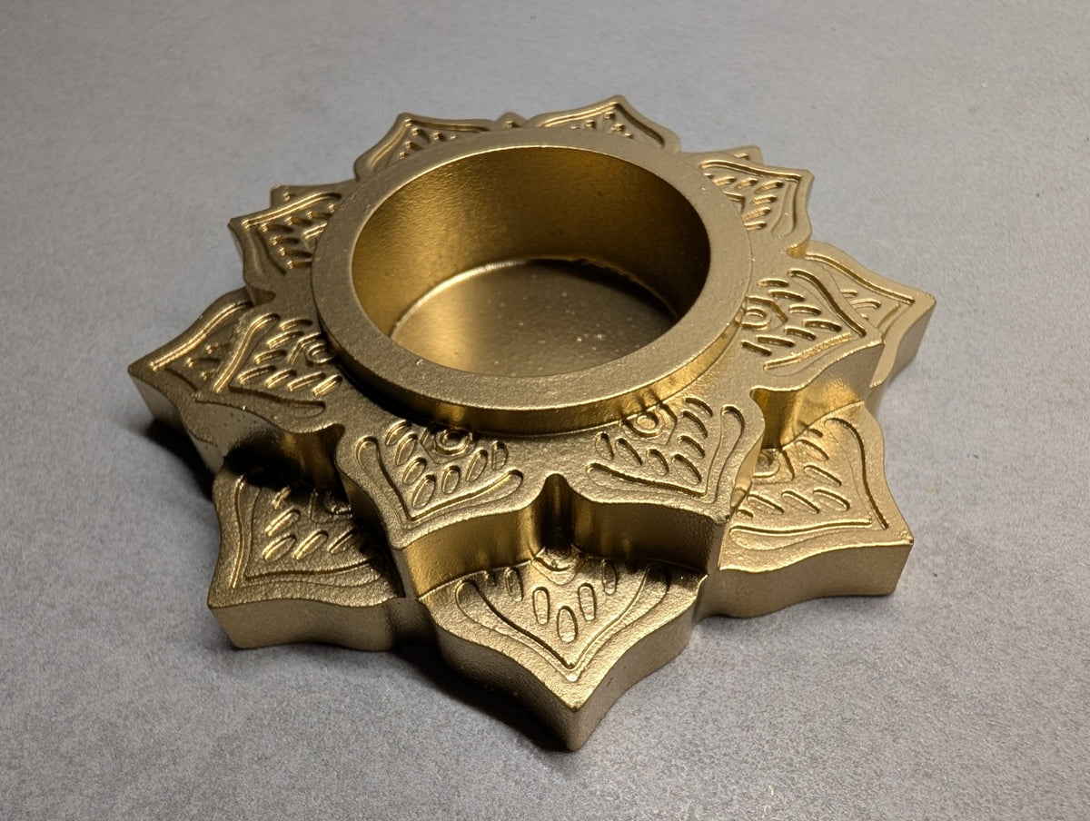Angled view of the Metallic Gold Jesmonite mandala tealight holder, showing the raised floral layers and depth of the central recess.
