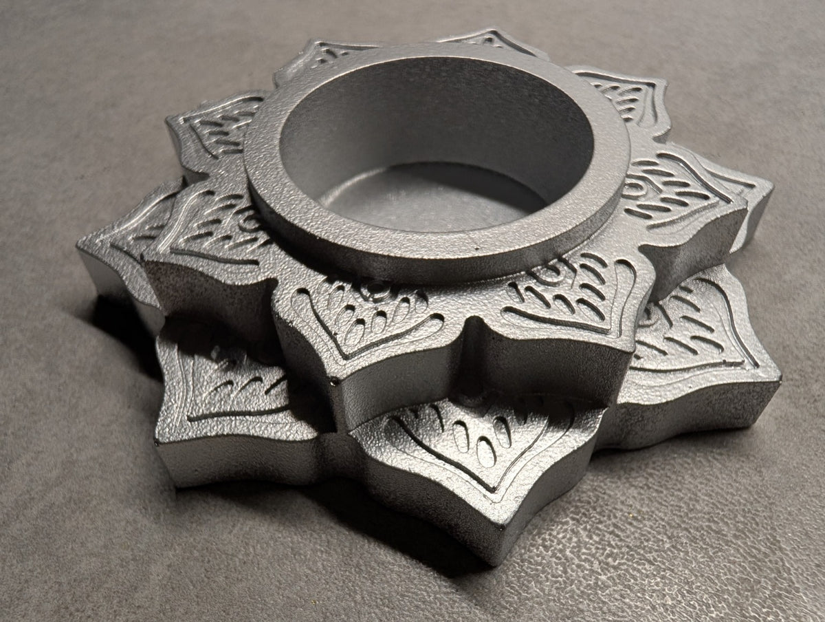 Angled view of the Silver Jesmonite mandala tealight holder, showing the raised floral layers and depth of the central recess.