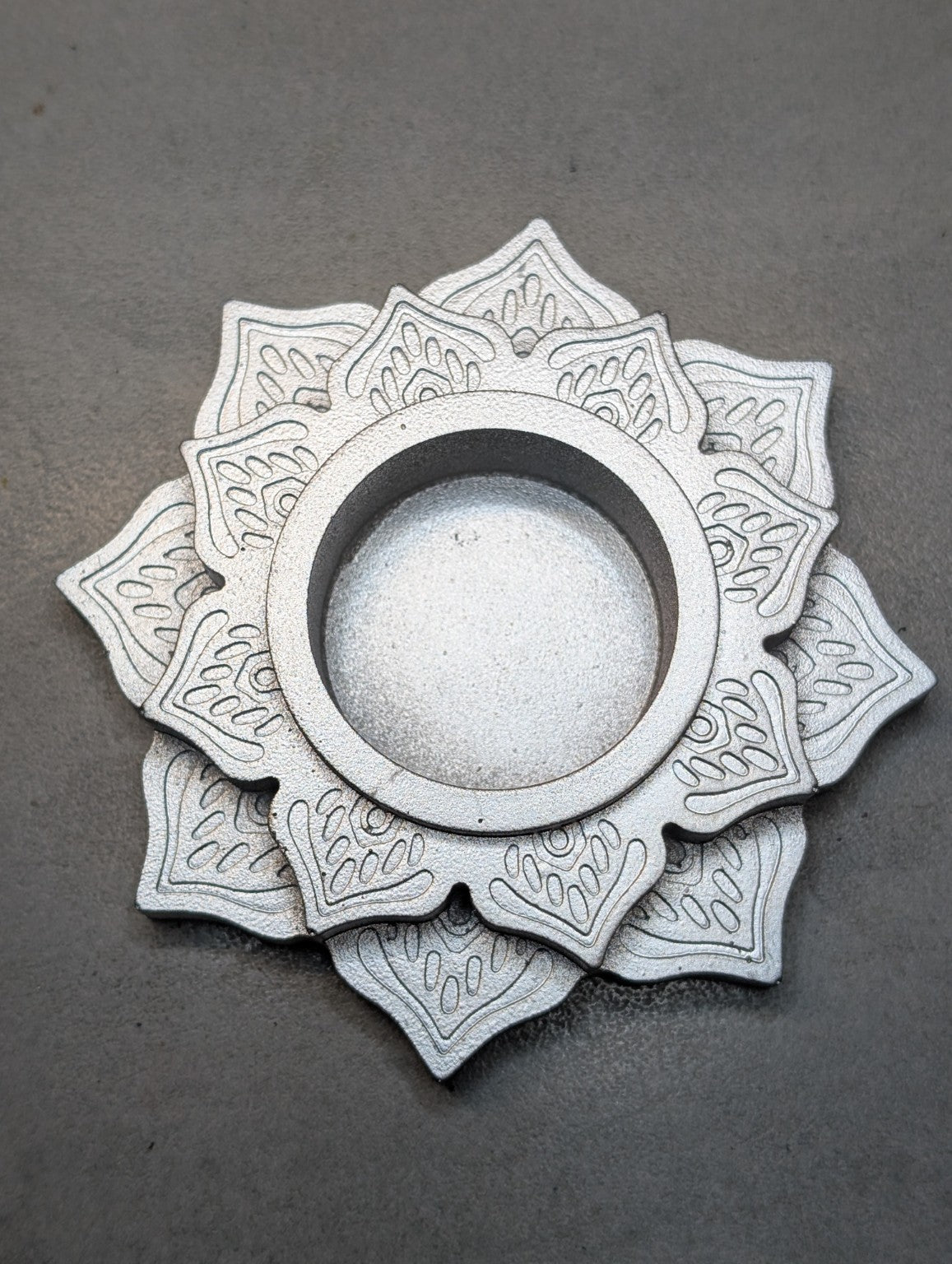Top view of the Silver Jesmonite mandala tealight holder, showing layered lotus petals and a central recess.